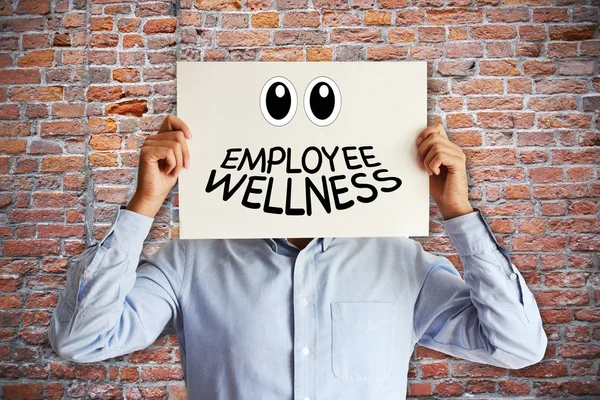 Employee wellness or benefits concept with man holding a paper board above head