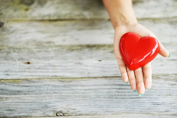 Close Shiny Red Heart Young Womans Hands Charity Concept — Stock Photo, Image