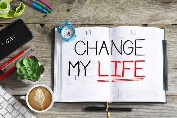 Change my life, personal goal or resolution for the new year handwritten on agenda