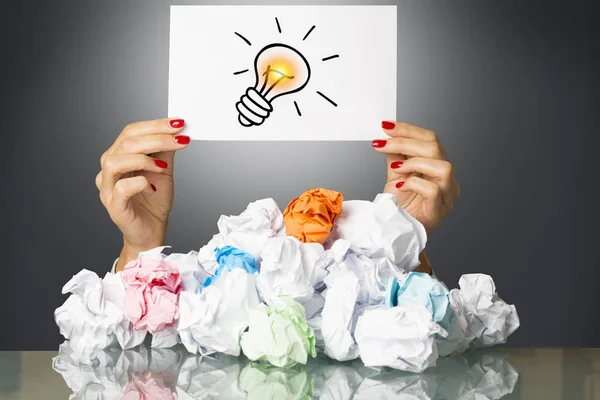 Got Idea Light Bulb Womans Hand Pile Crumpled Paper — Stock Photo, Image