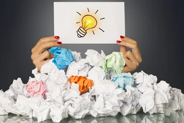 Got Idea Light Bulb Womans Hand Pile Crumpled Paper — Stock Photo, Image