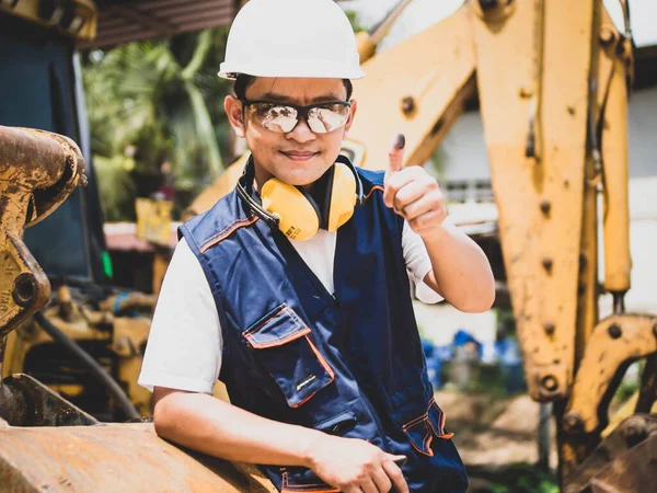 Engineer or Technician in heavy construction site. the professional mechanical men the employee of a car service.