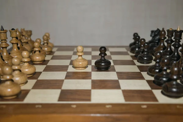 Chess game with wooden chess pieces.