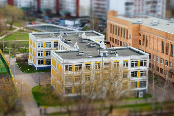 Aerial view on school building in Moscow. Tilt shift effect photography.