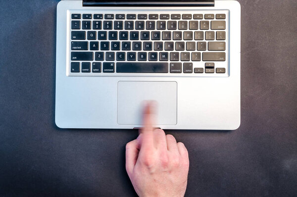 Workplace with notebook on black background