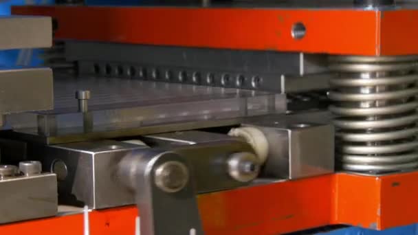 Cutting holes perforation stamping of metal sheets on industrial CNC machine. — Stock Video