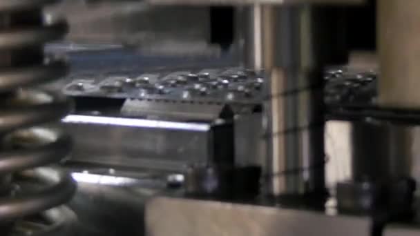 Cutting holes perforation stamping of metal sheets on industrial CNC machine. — Stock Video