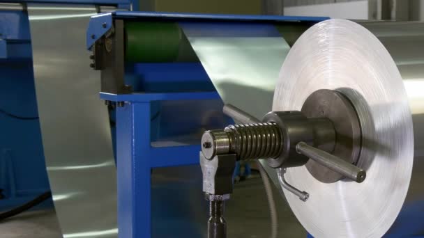 Roll of metal sheets on industrial CNC machine. — Stock Video