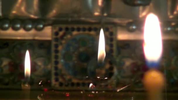 Candles burn before icon of Saint Elizabeth in monastery of New Martyrs. — Stock Video