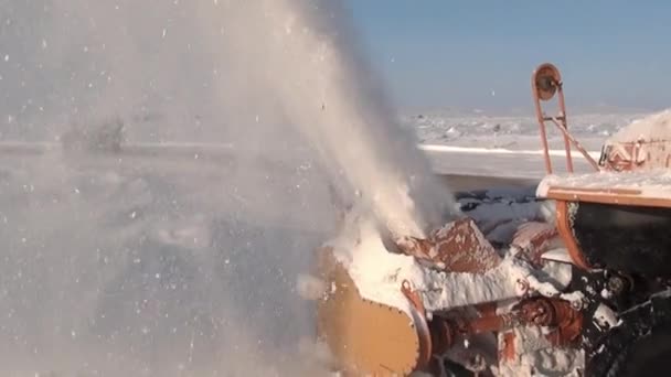 Snow-removing machine cleans road in Anadyr city on far north. — Stock Video