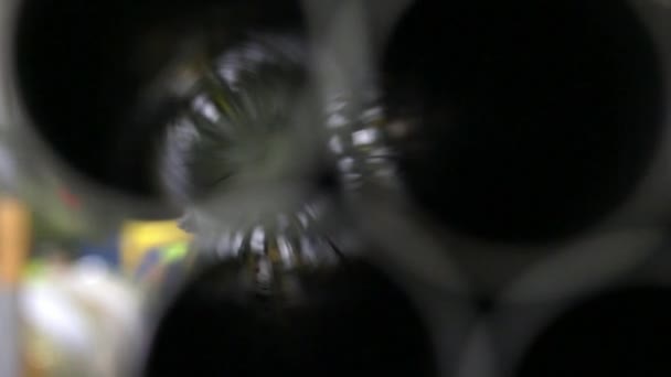 Reflection of light when shooting in defocus of shiny metal tube in factory. — Stock Video