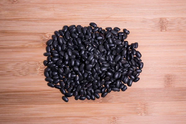 Raw Uncooked Black Beans Top View Wooden Table Natural Grain — Stock Photo, Image