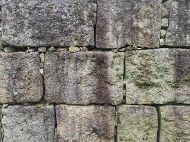 Düzenli şekilli dikdörtgen taş bloklu taş duvar dokusu.