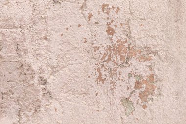 Eski sert beton arka plan dokusu. Pembeye boyanmış, eskimiş ve soyulmuş..