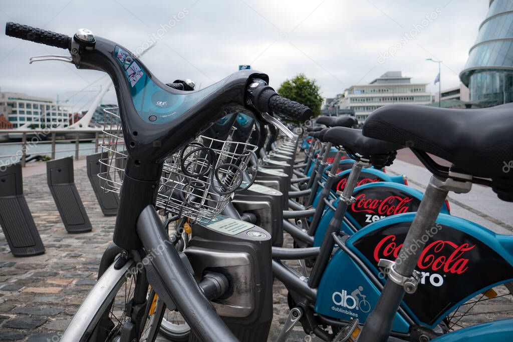 Dublin Bikes rental  - row of bikes in street. Dublin, Ireland.