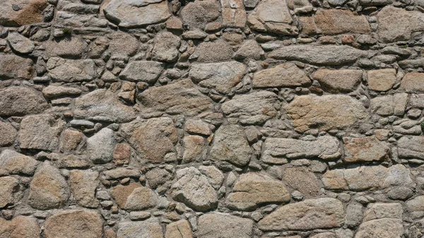 歴史的な城の古い 不均一な石の壁 素朴な背景の質感 — ストック写真