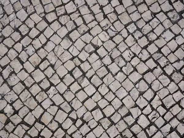 Typical Portuguese pavement / sidewalk in Porto, northern Portugal. Diagonal lines.
