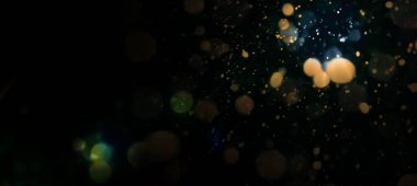 Siyah arkaplan üzerindeki soyut doku bokeh renginde