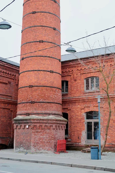 brick tower at the old building against the sky on a cloudy day