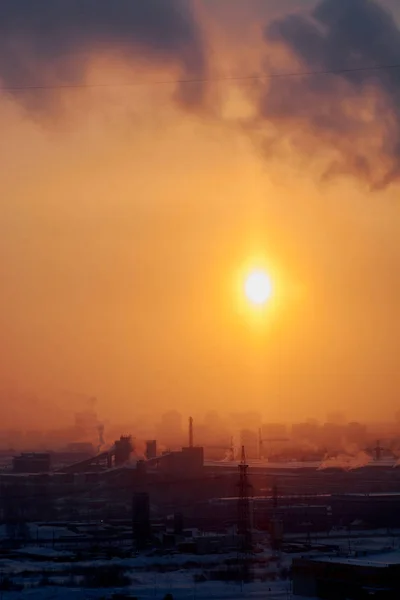 dawn in the city in the winter among high-rise buildings