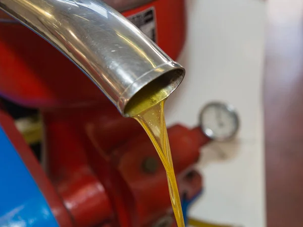 Flowing Oil from Steel Pipe: Closeup View of Olive Oil Mill — Stock Photo, Image