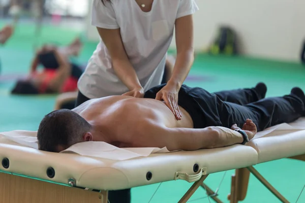 Athlete\'s Back Professional Massage on Bed after Sport Fitness Activity