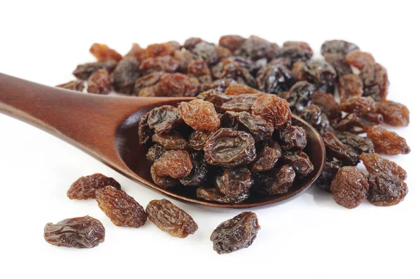 Raisins Secs Dans Une Cuillère Bois Photo De Stock