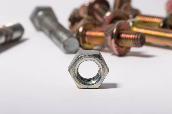 Rusty screw and nuts isolated on white background. — Stock Photo, Image