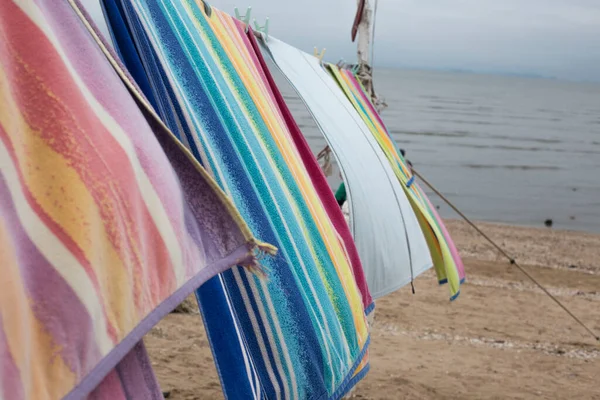 Beach towel blowing in the wind on a line