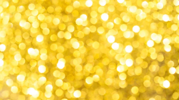 Soyut bir arkaplan için altın bokeh.
