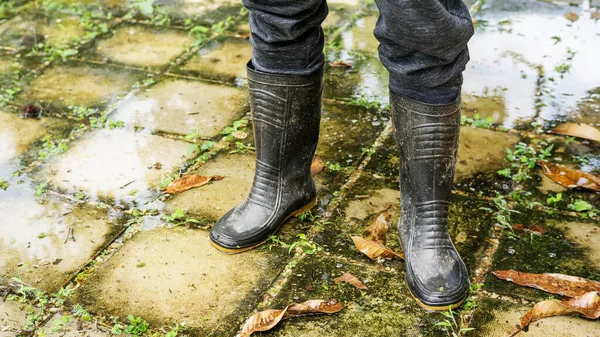 Men wear black boots for a flood.