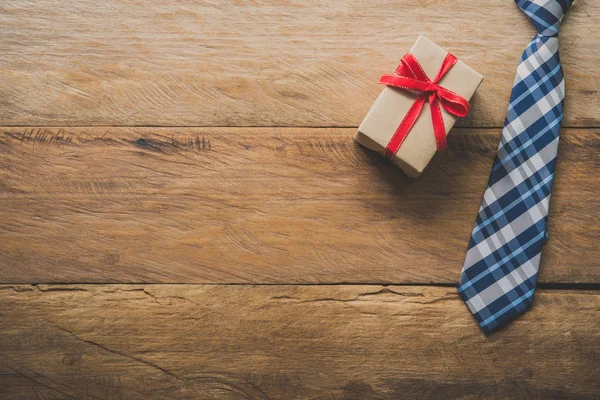 Father\'s Day Gift Ideas - Neckties and gift boxes are placed on wooden floor.