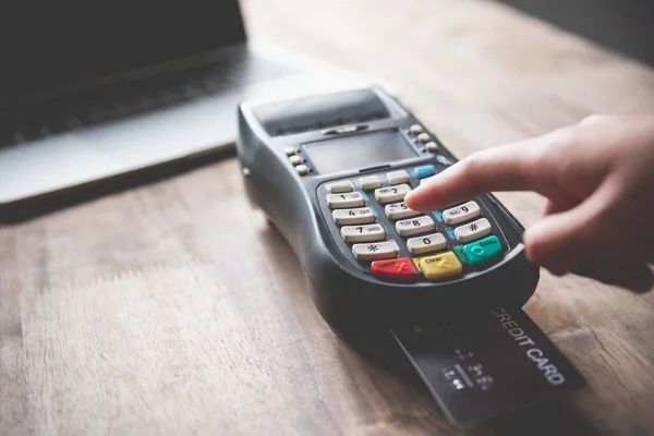 Paying by credit card , buying and selling products using a credit card swipe machine