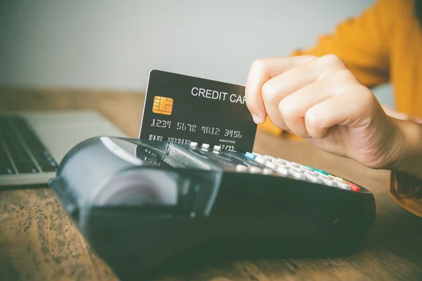 Paying by credit card , buying and selling products using a credit card swipe machine