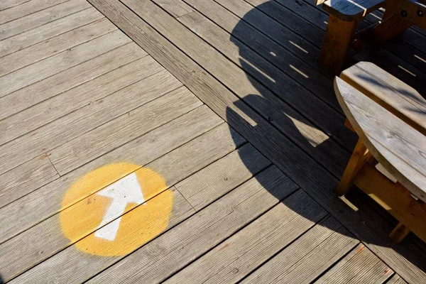 Social distancing markers are on outside tables and chairs to ensure safety after lockdown. No seating signs and one way systems are evident everywhere