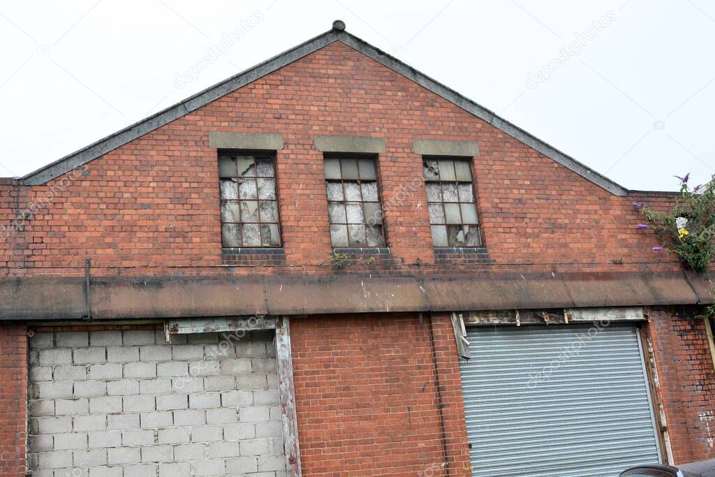 Derelict buildings on dock, old lock ups and storage units left empty for years