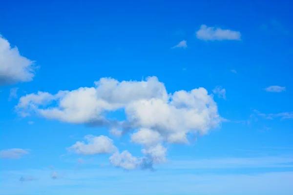 Cloudscape, white clouds on a deep blue skyLarge white and fluffy clouds on a deep blue summer sky