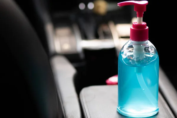 Blue alcohol gel bottle placed in the car. For washing hands Anti-virus and anti-bacteria and anti-virus Covid-19. copy space.