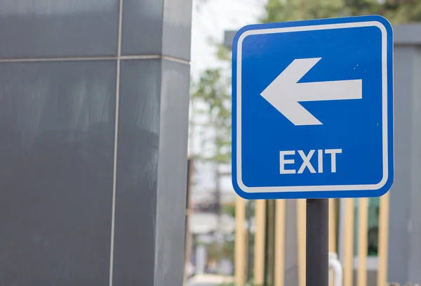 Blue Exit Sign, Metal Exit Sign, Parking Exit in Condo. Symbol. copy space. selective focus.