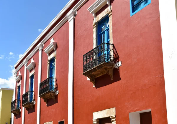 Red colonial style house in Campeche with blue windows
