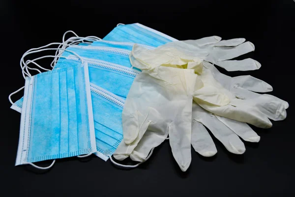 Blue protective masks and white disposable gloves are in short supply due to the Covid 19 crisis