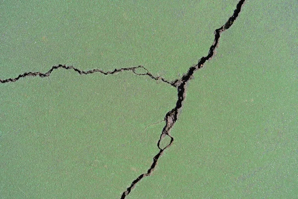 Tenis kortunun yeşil boyalı asfaltının arka planı