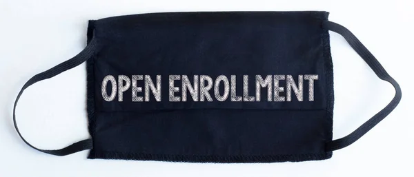 Black Disposable Protective Mask Open Enrollment Text Black Background — Stock Photo, Image