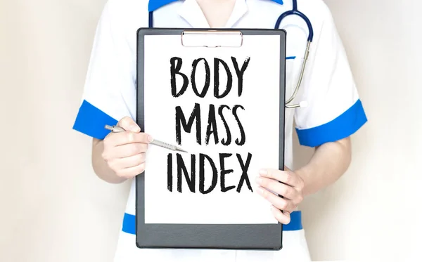 Doctor holding a card with BMI, Body Mass Index sign on white background