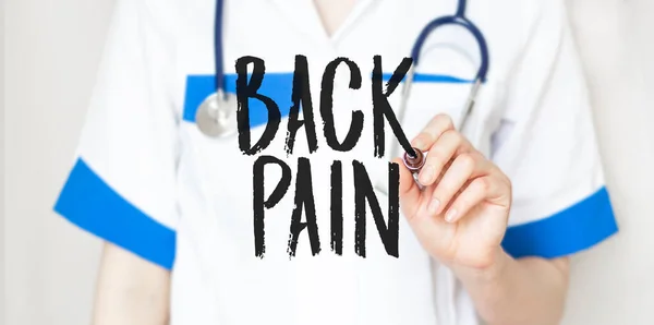 Woman Doctor Writing Word Back Pain Marker Medical Concept — Stock Photo, Image