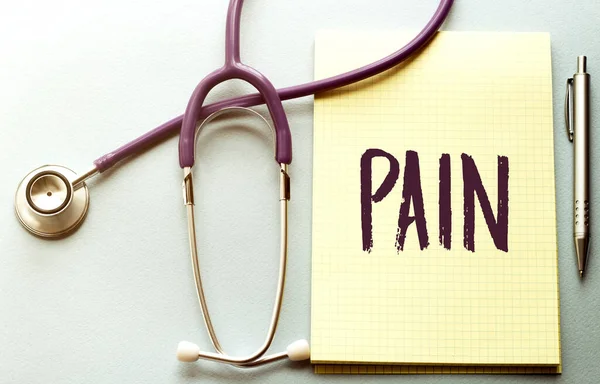 Purple Background Stethoscope Yellow List Text Pain — Stock Photo, Image