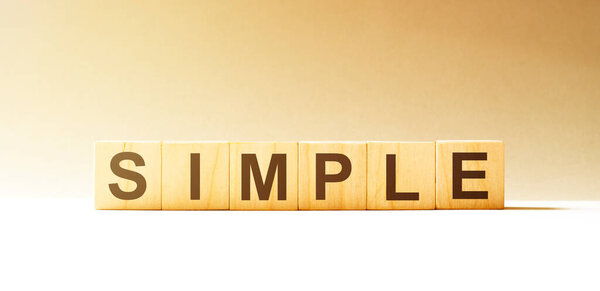 Word SIMPLE made with wood building blocks