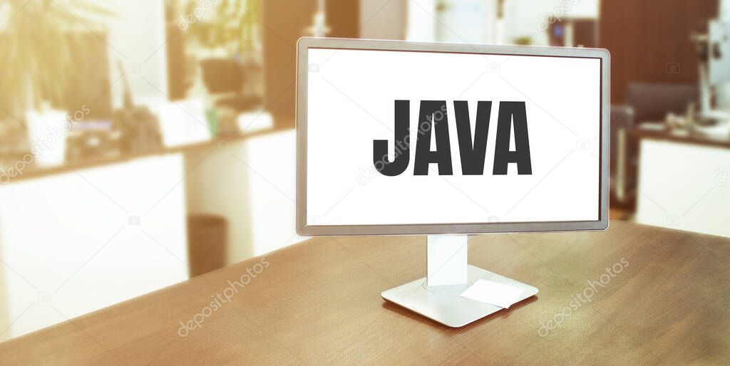 Monitor in modern office with JAVA text on the screen