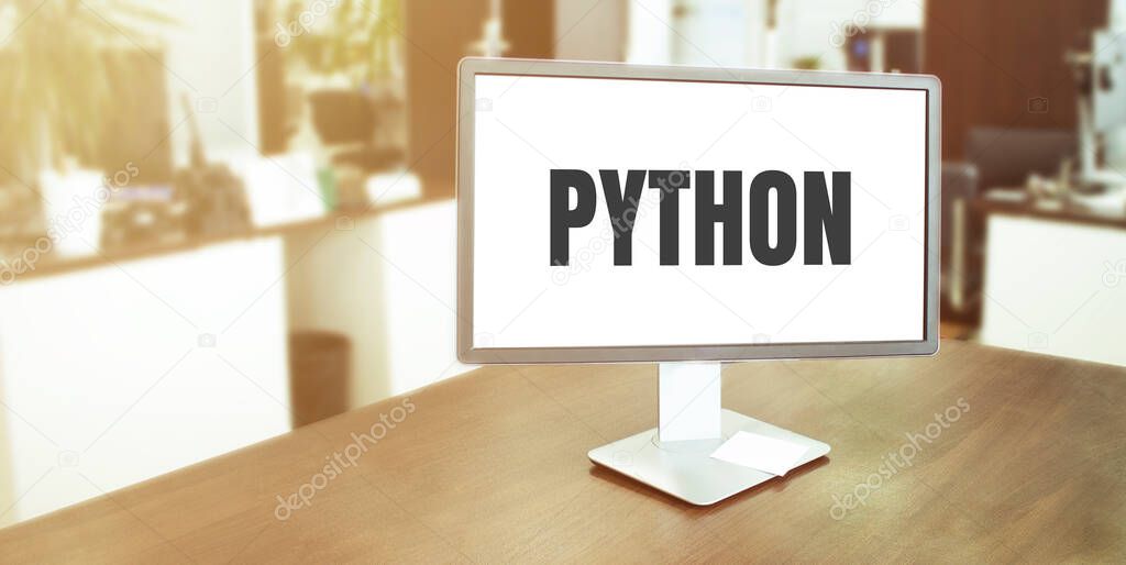 Monitor in modern office with PYTHON text on the screen