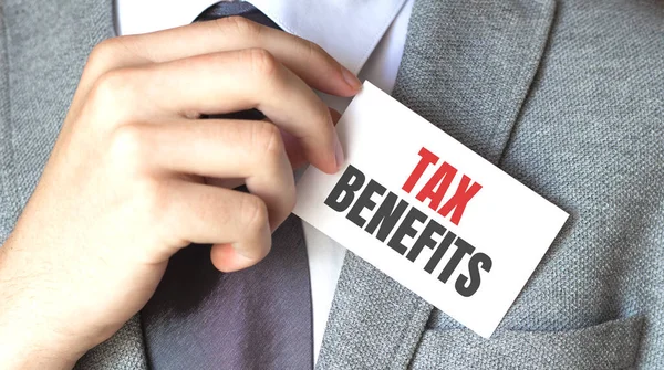 Businessman Holding Card Text Tax Benefits — Stock Photo, Image